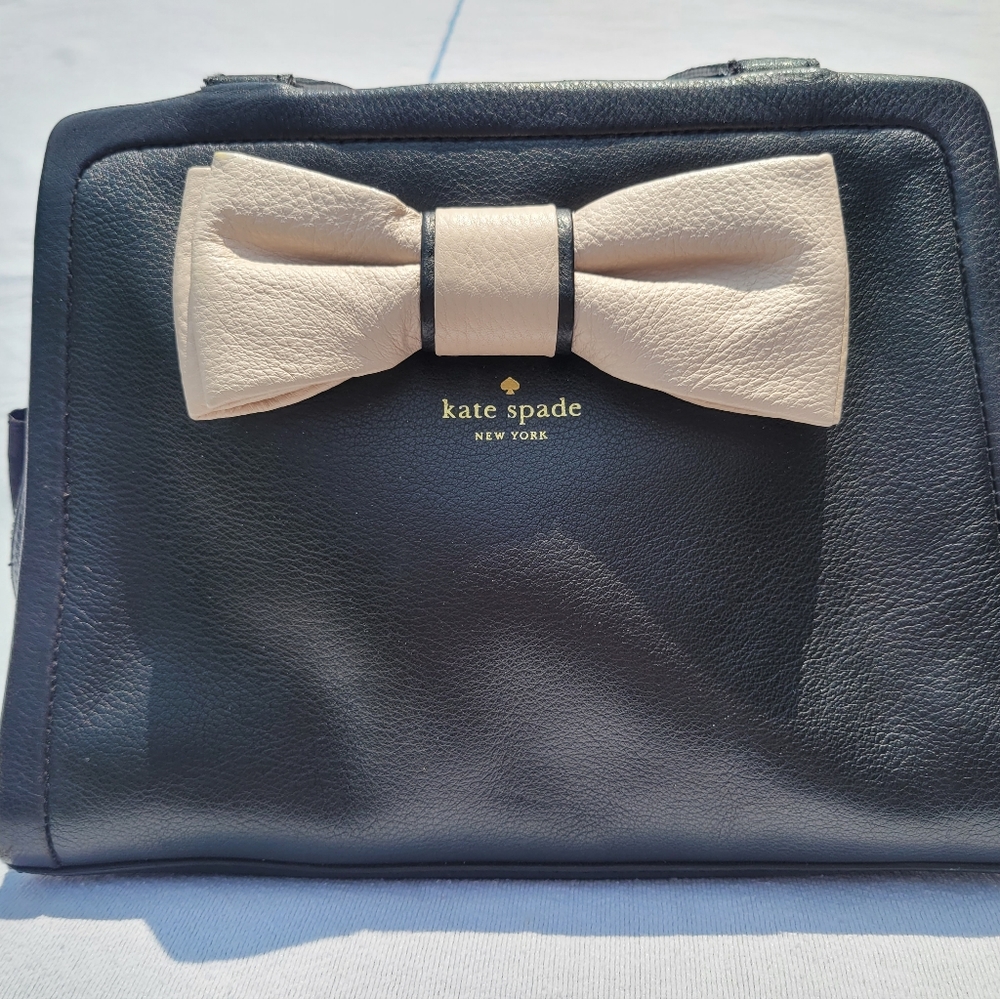 Kate Spade purse with a bow.